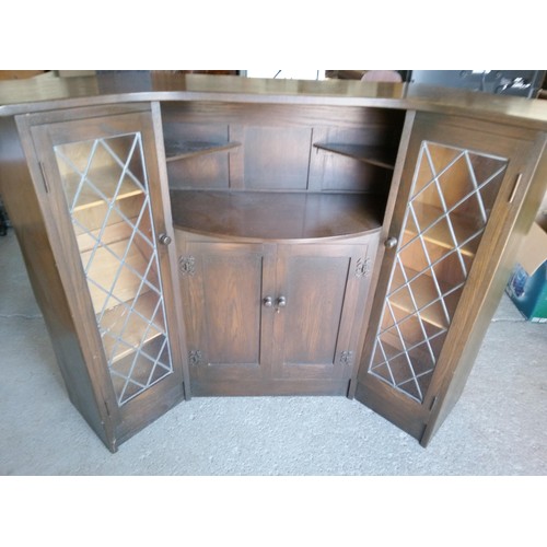 356 - A Heavy Oak Corner Bar with Carved Details and Leaded Glass Cupboard Doors (2 Panes Cracked).