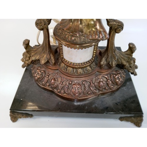 593 - A Heavy Bronze Cherub/Putti Lamp on a Black Marble Base. 72cm High with Shade, 54cm High Without Sha... 