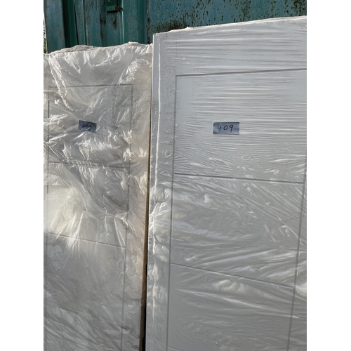 409 - Pair 2ft 6 pressed panel doors