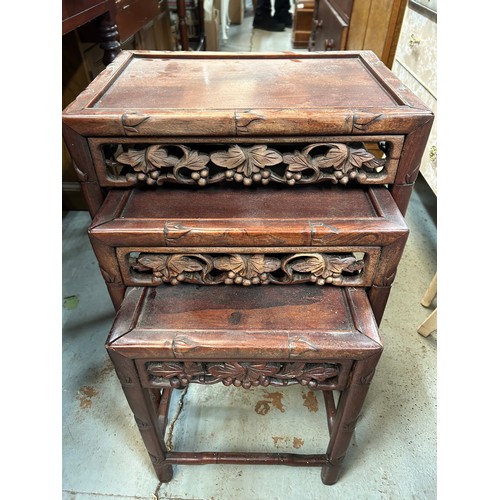 793B - A Nest of 3 Heavily Carved Dark Wood Coffee Tables.