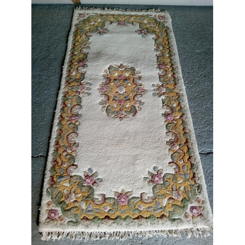 283 - A Handmade Wool Rug by Eastern Carpets, Benlian Ltd.
190cm x 90cm.