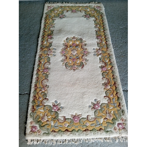 283 - A Handmade Wool Rug by Eastern Carpets, Benlian Ltd.
190cm x 90cm.