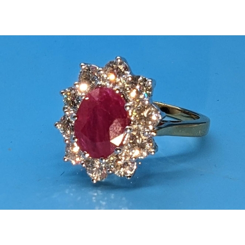 588 - Certificated 18ct yellow gold oval ruby and diamond cluster ring.  Ruby 2.25ct.  Diamonds 1.50ct.  C... 