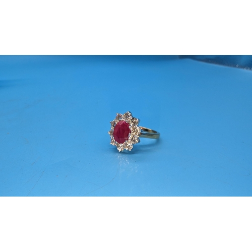 588 - Certificated 18ct yellow gold oval ruby and diamond cluster ring.  Ruby 2.25ct.  Diamonds 1.50ct.  C... 