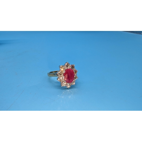 588 - Certificated 18ct yellow gold oval ruby and diamond cluster ring.  Ruby 2.25ct.  Diamonds 1.50ct.  C... 