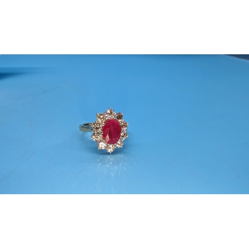 588 - Certificated 18ct yellow gold oval ruby and diamond cluster ring.  Ruby 2.25ct.  Diamonds 1.50ct.  C... 