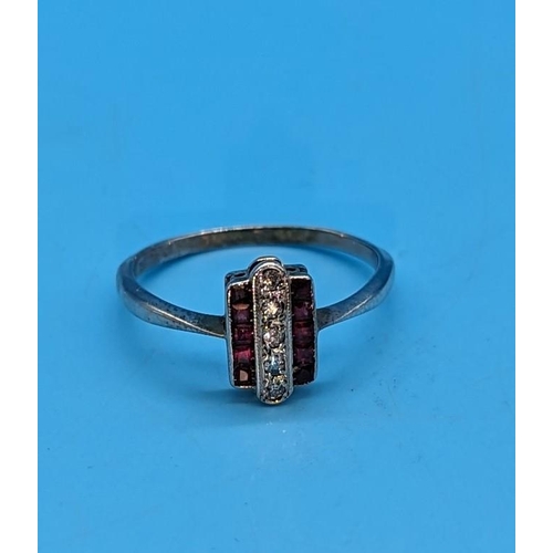 576 - An 18ct Hallmarked White Gold Plated Art Deco Diamond and Ruby Ring. Size P/Q.