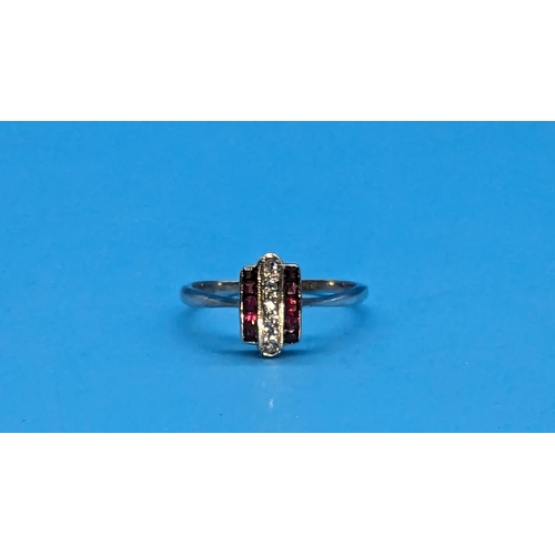 576 - An 18ct Hallmarked White Gold Plated Art Deco Diamond and Ruby Ring. Size P/Q.