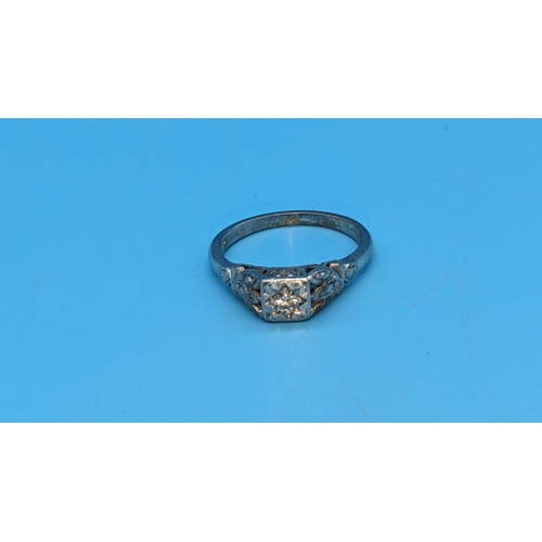 583 - A Diamond and 18ct White Gold Ring. Size N/O. 4gms Total Weight.