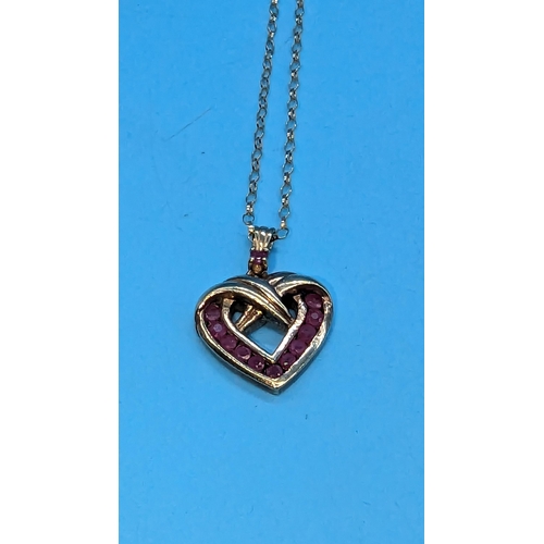 577 - A 9ct Gold and Ruby Heart Shaped Pendant Necklace. 4.6gms.