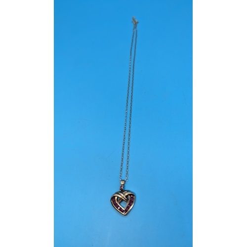 577 - A 9ct Gold and Ruby Heart Shaped Pendant Necklace. 4.6gms.