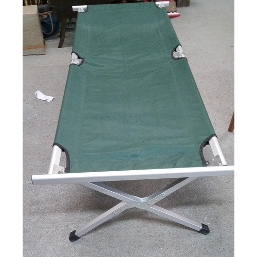 149 - A Pair of Canvas and Metal Framed Folding Beds inn Green with Carry Bags.