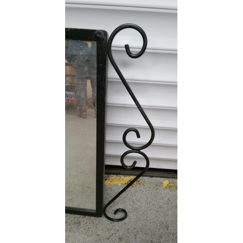 927 - A Mirror with Ornate Metal Surround