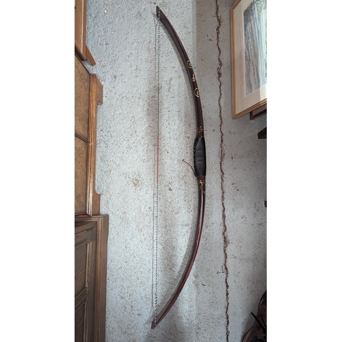 92 - An Ornamental Long Bow 140cm