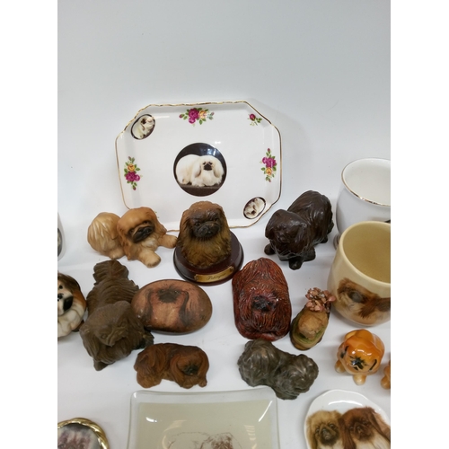 693 - A Selection of Pekingese China Dogs and more.