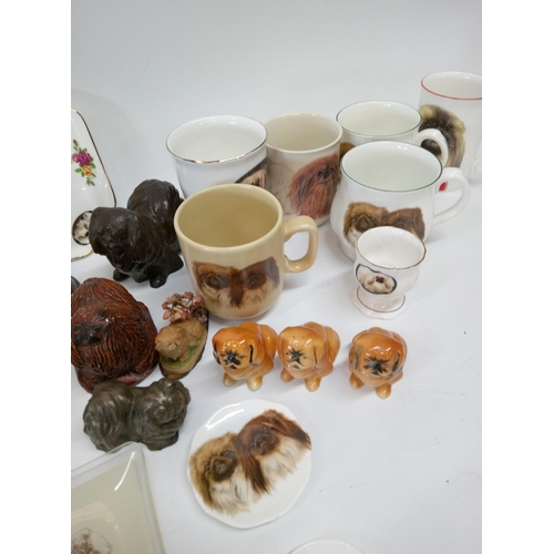 693 - A Selection of Pekingese China Dogs and more.