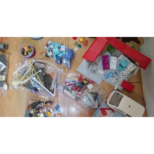 1201 - A Large Quantity of Playmobile Including Buildings, Vehicles, Characters and Much More.