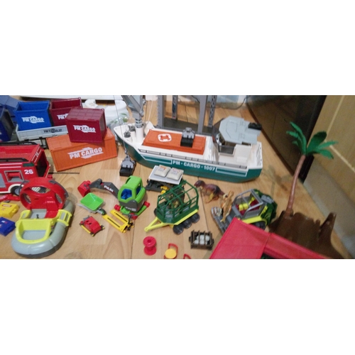 1201 - A Large Quantity of Playmobile Including Buildings, Vehicles, Characters and Much More.