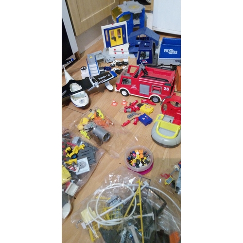 1201 - A Large Quantity of Playmobile Including Buildings, Vehicles, Characters and Much More.