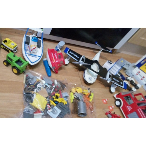 1201 - A Large Quantity of Playmobile Including Buildings, Vehicles, Characters and Much More.