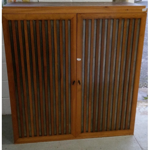 729 - A Vintage Wood Clad Storage Unit with Double Doors and Shelf. 137cm H x 128cm W x 57cm D.