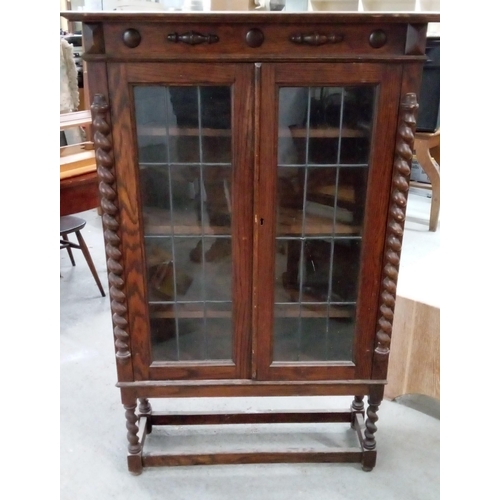 730 - An Antique Bookcase/Display Cabinet with Leaded Glass Doors, Turned Legs and 4 Shelves. 139cm H x 92... 