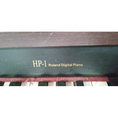 325 - A Roland HP-1 Digital Piano with Foot Pedals and Stool. 82cm H x 139cm W x 43cm D.