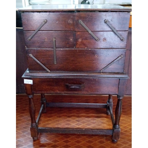 740 - A Concertina Sewing Box with contents on a Small Side Table in need of attention to fixings.