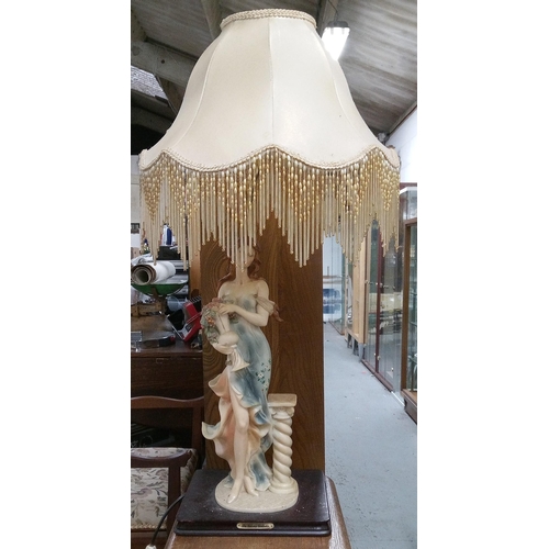 386 - A Lady Statue Table Lamp with Fringed Shade and a plaque with the 