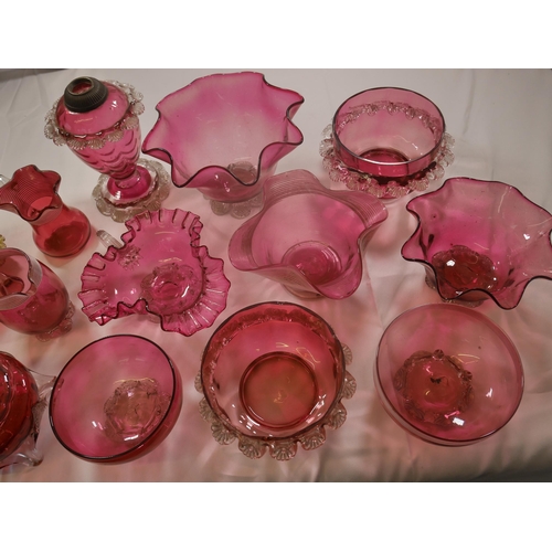 68 - A GROUP OF VICTORIAN CRANBERRY GLASS WARES, the lot including a powder bowl and cover, three jugs, h... 