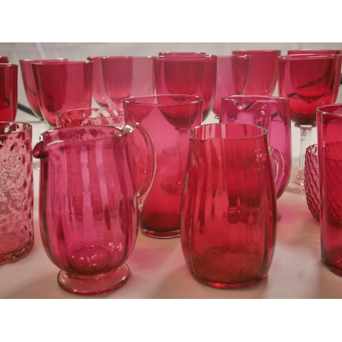 69 - A GROUP OF VICTORIAN CRANBERRY GLASS WARES, including eight pieces of Mary Gregory painted figure de... 