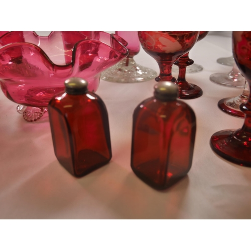 70 - A GROUP OF 19TH CENTURY CRANBERRY GLASS WARES, including two trumpet vases, jugs, bowl and stemmed g... 