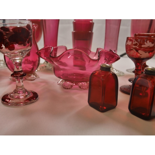 70 - A GROUP OF 19TH CENTURY CRANBERRY GLASS WARES, including two trumpet vases, jugs, bowl and stemmed g... 