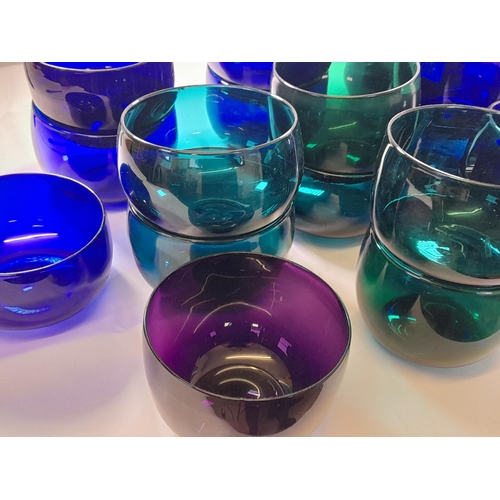 71 - A LARGE GROUP OF VINTAGE GLASS BOWLS, including emerald glass, amethyst glass and blue glass example... 