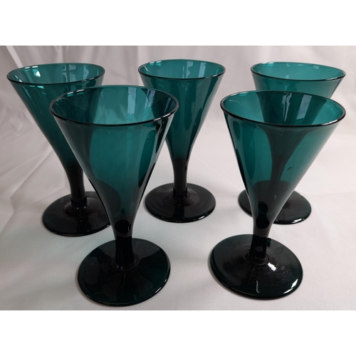 78 - A SELECTION OF TWELVE 19TH CENTURY EMERALD GLASSES, with conical and tapering bowls, some on knopped... 