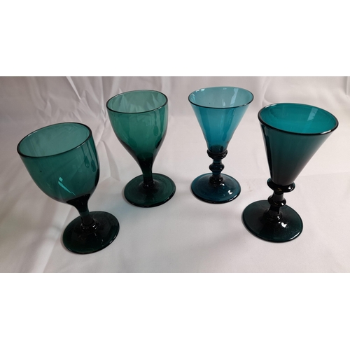 78 - A SELECTION OF TWELVE 19TH CENTURY EMERALD GLASSES, with conical and tapering bowls, some on knopped... 