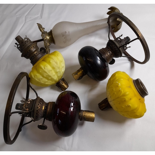 79 - A 19TH CENTURY OVERLAID GLASS OIL LAMP BASE AND OTHER GLASS LAMP RESERVOIRS AND FITTINGS, along with... 