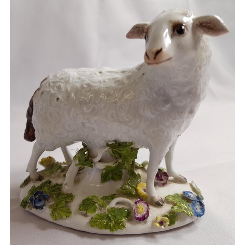 82 - A MID 18TH CENTURY MEISSEN FIGURE OF A EWE, on an oblong tree trunk mound base, with applied branche... 