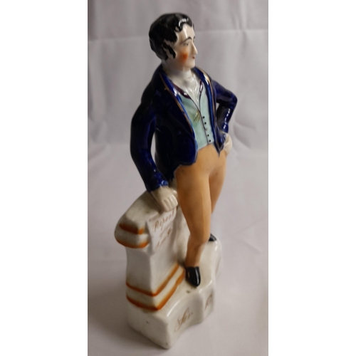 84 - A STAFFORDSHIRE MID 19TH CENTURY FIGURE OF SIR ROBERT PEEL, modelled with hand on hip, the other han... 