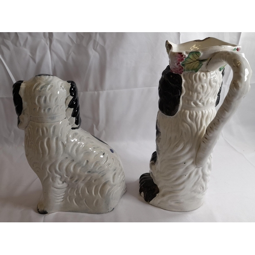 86 - A MID 19TH CENTURY STAFFORDSHIRE PITCHER, modelled as a spaniel wearing a tricorn hat, along with th... 