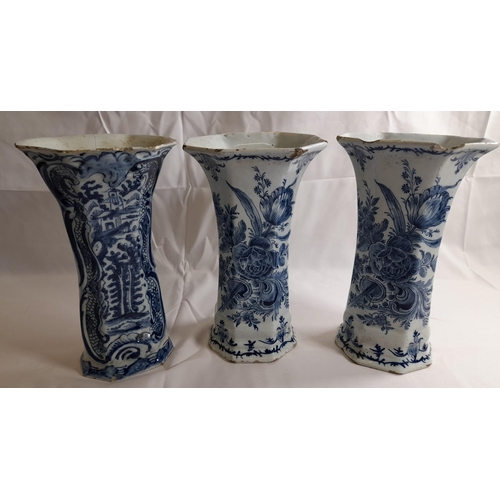 87 - A PAIR OF DELFT 18TH CENTURY OCTAGONAL BEAKER VASES, with flared mouths, the sides painted with flow... 