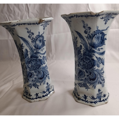 87 - A PAIR OF DELFT 18TH CENTURY OCTAGONAL BEAKER VASES, with flared mouths, the sides painted with flow... 