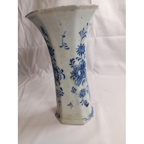 87 - A PAIR OF DELFT 18TH CENTURY OCTAGONAL BEAKER VASES, with flared mouths, the sides painted with flow... 