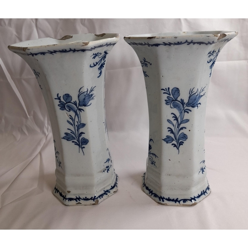 87 - A PAIR OF DELFT 18TH CENTURY OCTAGONAL BEAKER VASES, with flared mouths, the sides painted with flow... 