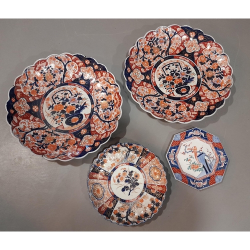 91 - A PAIR OF JAPANESE LOBED IMARI CHARGERS, along with a smaller lobed plate and an octagonal plate, al... 