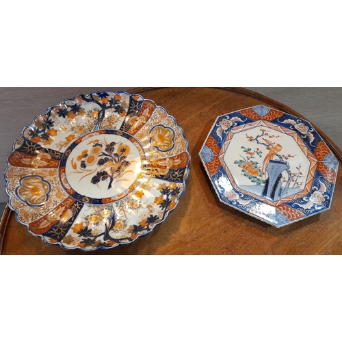 91 - A PAIR OF JAPANESE LOBED IMARI CHARGERS, along with a smaller lobed plate and an octagonal plate, al... 