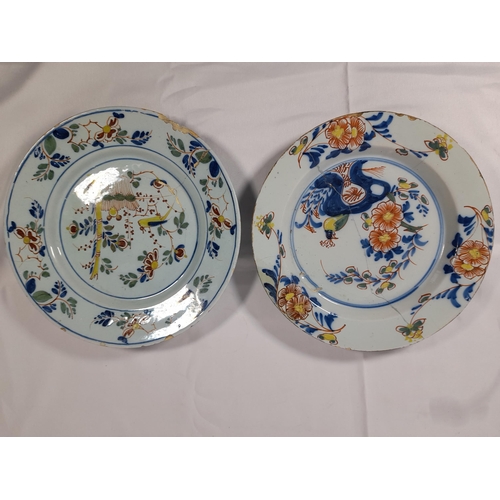 117 - TWO DELFT LATE 18TH/EARLY 19TH CENTURY POLYCHROME PLATES, decorated with birds and floral sprays, al... 