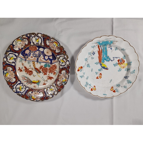 117 - TWO DELFT LATE 18TH/EARLY 19TH CENTURY POLYCHROME PLATES, decorated with birds and floral sprays, al... 