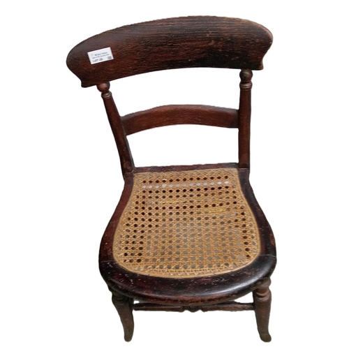 25 - An Antique Childs Chair with Rattan Seat.