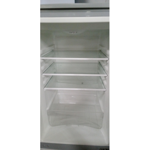 294 - A Naiko Fridge Freezer (Fridge at Top). 141cm H x 50cm x 60cm.